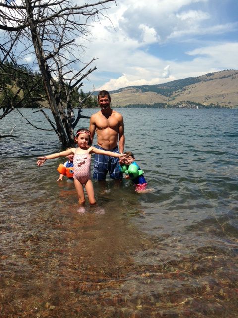 Testing the water. Way too cold! But look how clear it is! And those mountains. Amazing.